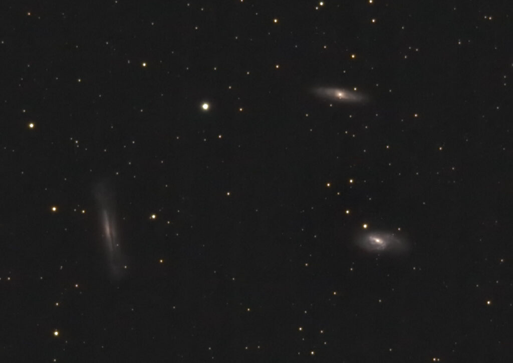 Clockwise from top: Messier 65, Messier 66, and NGC 3628 (the Hamburger Galaxy)