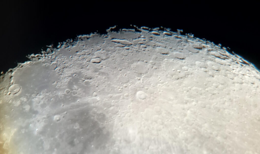 An image of the Moon, with craters highlighted by low-angle sunlight along the terminator.